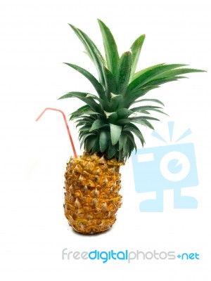 Pineapple With Straw Stock Photo