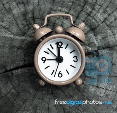 Pink Alarm Clock On Old Wooden Texture Stock Photo