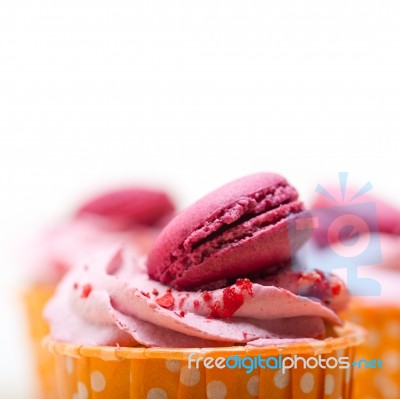 Pink Berry Cream Cupcake With Macaroon On Top Stock Photo