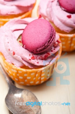 Pink Berry Cream Cupcake With Macaroon On Top Stock Photo