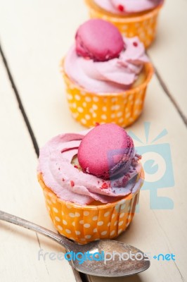 Pink Berry Cream Cupcake With Macaroon On Top Stock Photo