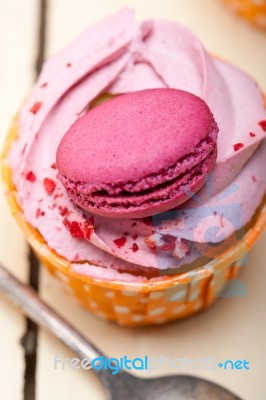 Pink Berry Cream Cupcake With Macaroon On Top Stock Photo