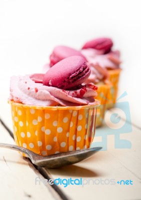 Pink Berry Cream Cupcake With Macaroon On Top Stock Photo