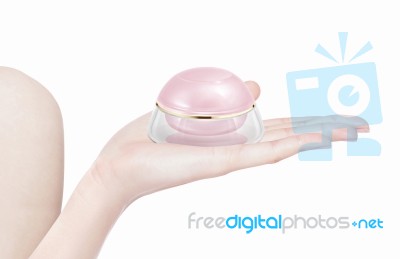 Pink Dome Cosmetic Jar On Hand Isolated Stock Photo