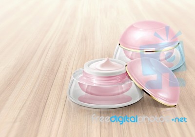 Pink Dome Cosmetic Jar On Wood Background Stock Photo