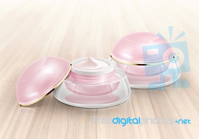 Pink Dome Cosmetic Jar On Wood Background Stock Photo