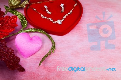 Pink Heart-shaped And Jewelry In Red Velvet Box Stock Photo