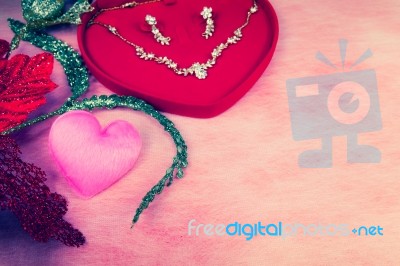 Pink Heart-shaped And Jewelry In Red Velvet Box Stock Photo