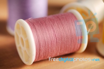 Pink Thread On Wood Table Shallow Depth Of Field (soft Focus) Stock Photo