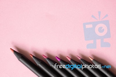 Pink Tone Colour Black Pencils On Pastel Pink Background Stock Photo