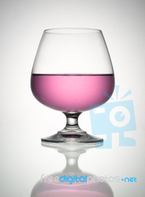 Pink Wine In Brandy Glass Stock Photo