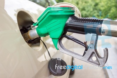 Pistol Grip Filling Car Tank With Gasoline Stock Photo