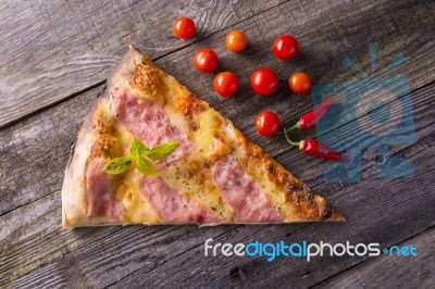 Pizza On Wooden Table, Cherry Tomato And Hot Peppers Stock Photo