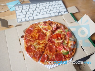 Pizza On Working Table Stock Photo