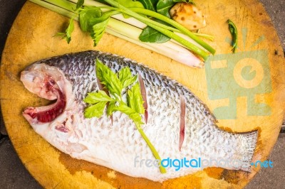 Place The Fish On A Cutting Board Stock Photo