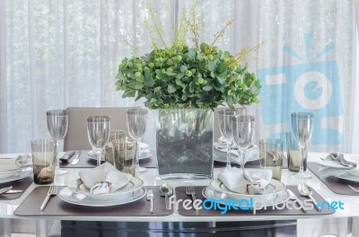 Plants In Glass Vase On Dinning Table Stock Photo