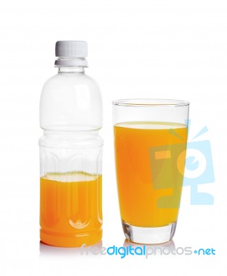 Plastic Bottle And Glass Of Orange Juice Stock Photo