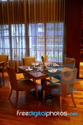 Plates And Glasses On The Table In The Restaurant Stock Photo