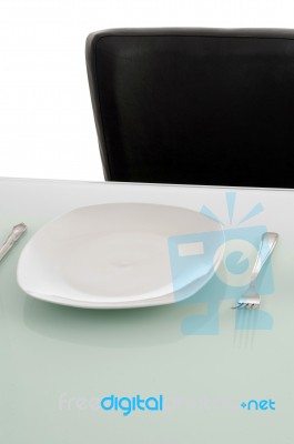 Plates On Dinning Table Stock Photo