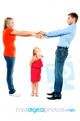 Playful Family Of Father, Mother And Daughter Stock Photo