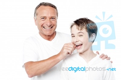 Playful Father And Son, Pinching Cheeks Stock Photo