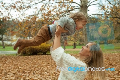 Playful Mother And Son In Park Stock Photo