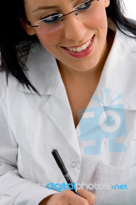 Pleased Doctor Looking Sideways Stock Photo