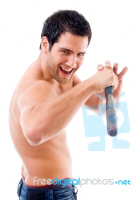 Pleased Man Posing With Stick Stock Photo