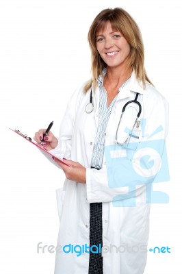 Pleasing Doctor Collecting Patient's Health History Stock Photo