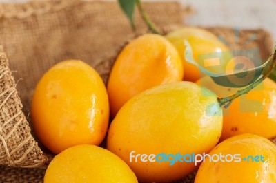 Plum On Wooden Stock Photo