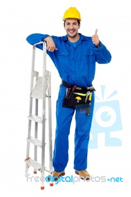 Plumber Posing Confidently With Thumbs Up Stock Photo