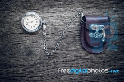 Pocket Watch On Old Wooden Background Stock Photo