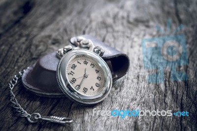 Pocket Watch On Old Wooden Background Stock Photo