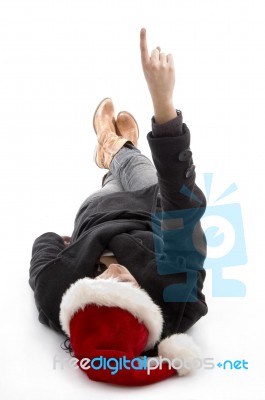 Pointing Female Wearing Christmas Hat Stock Photo