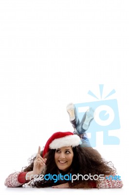 Pointing Girl Wearing Christmas Hat Stock Photo