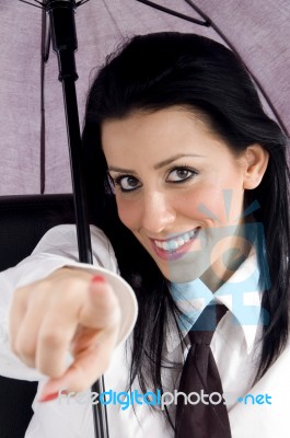 Pointing Professional Holding Umbrella Stock Photo