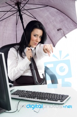 Pointing Woman With Umbrella And Computer Stock Photo