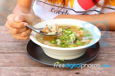 Pork And Mushroom Congee With Dip Hand Stock Photo