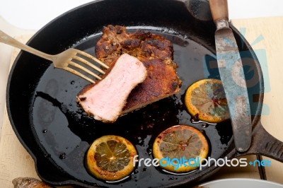 Pork Chop Seared On Iron Skillet Stock Photo