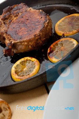 Pork Chop Seared On Iron Skillet Stock Photo