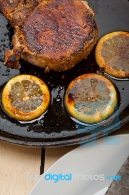 Pork Chop Seared On Iron Skillet Stock Photo