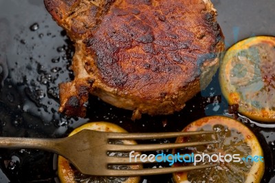 Pork Chop Seared On Iron Skillet Stock Photo