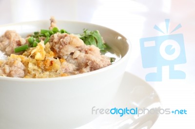 Pork Congee And Fried Garlic On Table Stock Photo