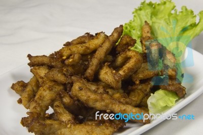 Pork Fried Thai Style In Green Salad Dressing Stock Photo