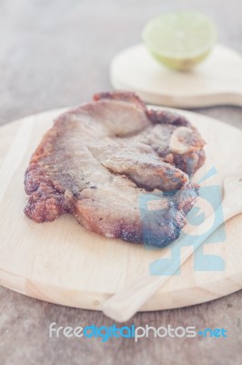 Pork Steak On Wooden Plate Stock Photo