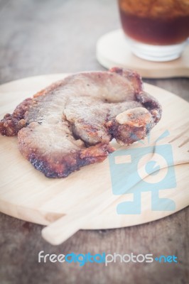 Pork Steak On Wooden Plate Stock Photo