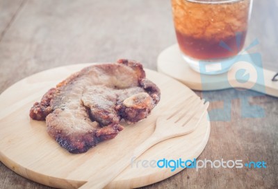 Pork Steak On Wooden Plate Stock Photo