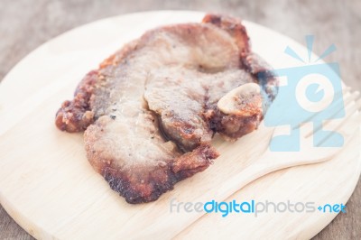 Pork Steak On Wooden Plate Stock Photo