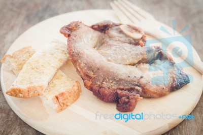 Pork Steak On Wooden Plate Stock Photo