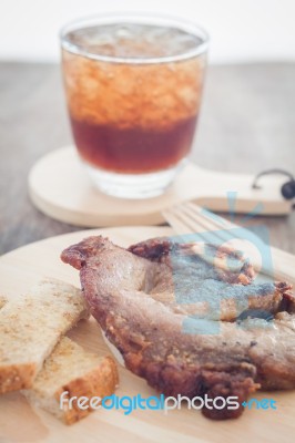 Pork Steak On Wooden Plate Stock Photo